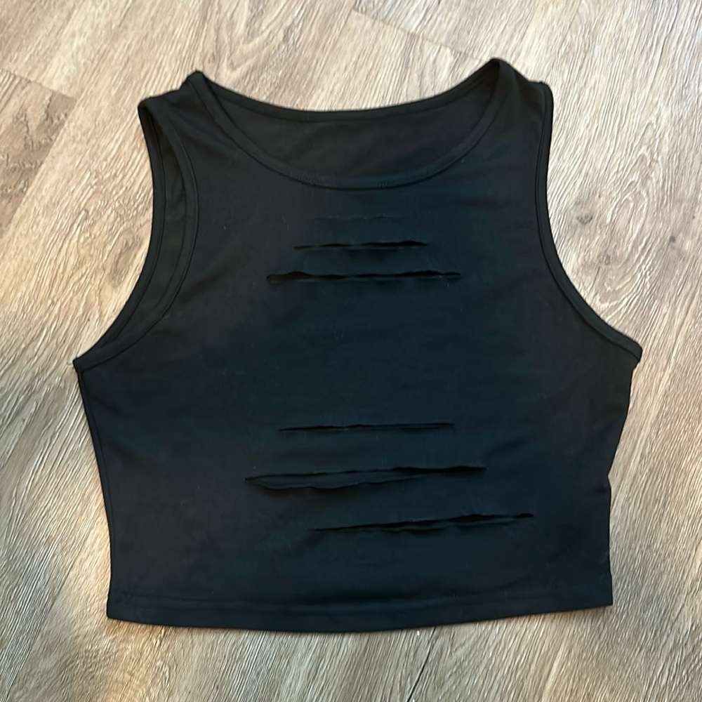 Cute black crop top with slits.